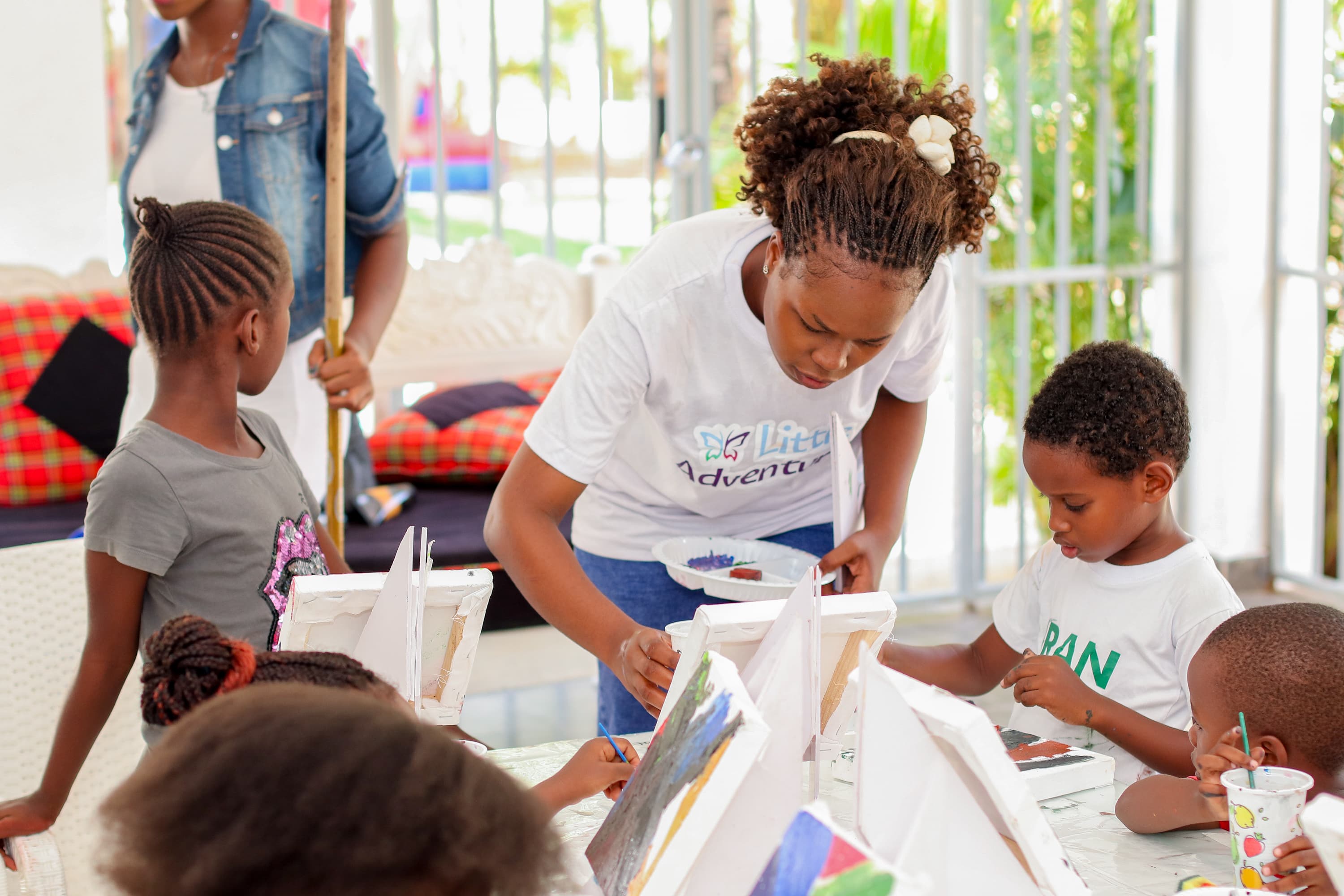 Teacher Rita with students during a learning activity
